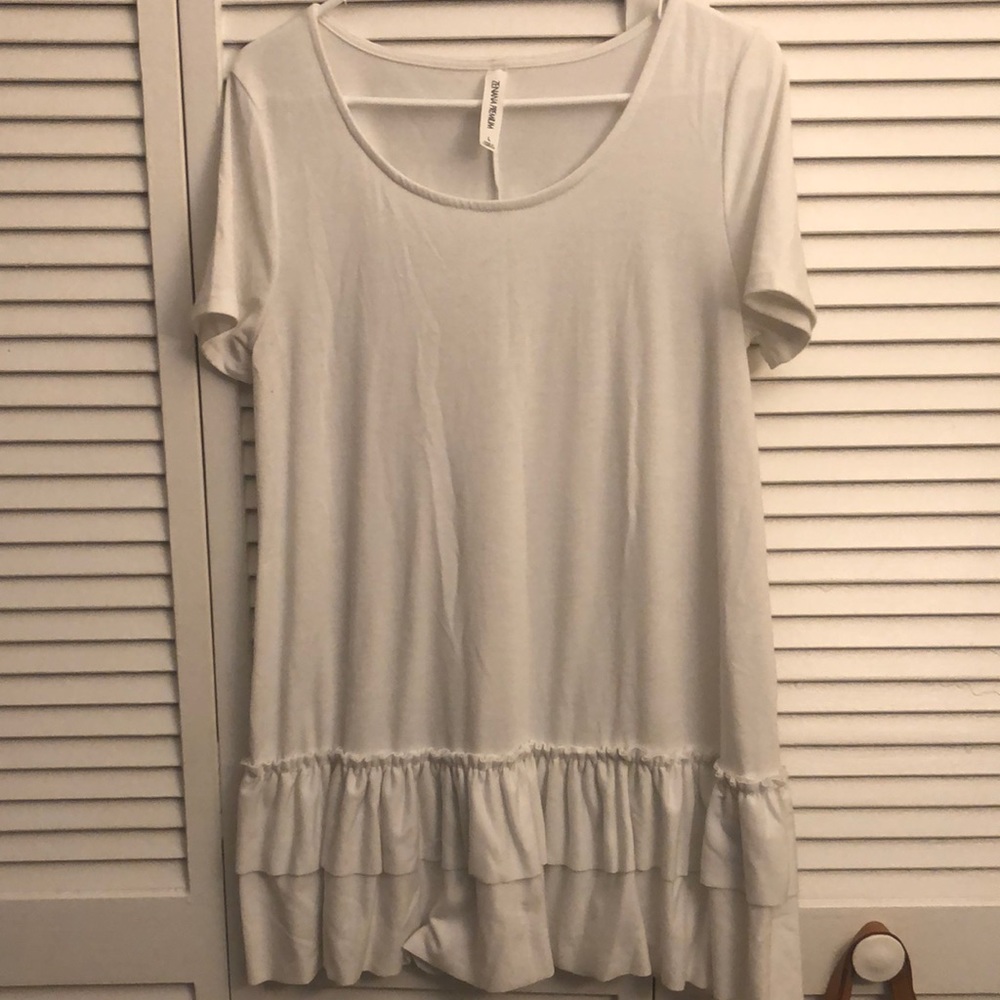 Boutique white top with ruffle bottom size large